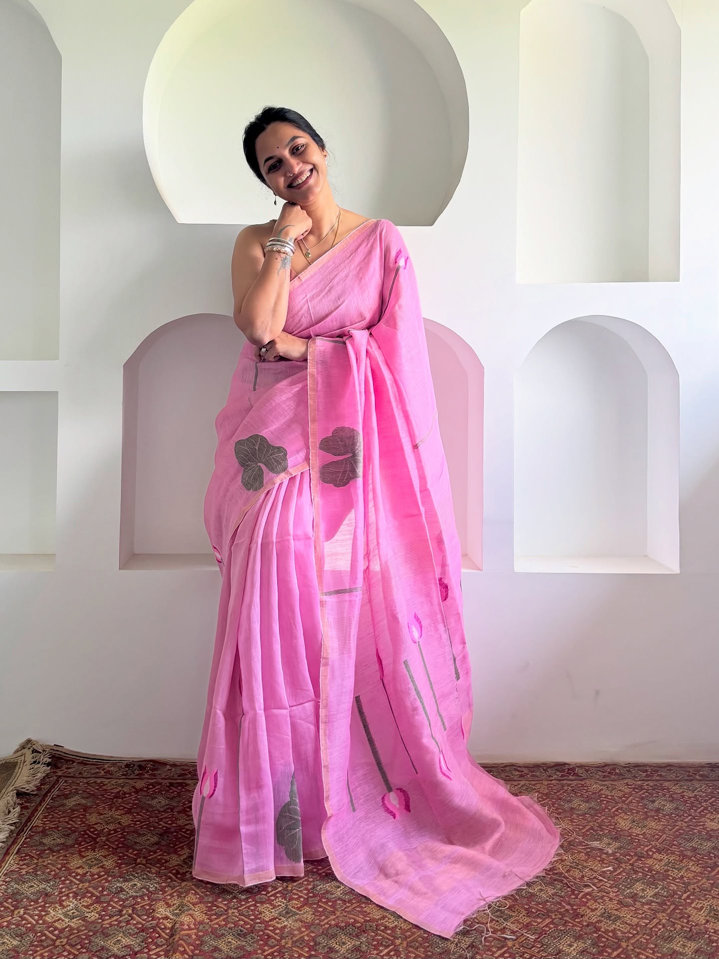 “Introducing our stunning pink Muslin Linen Silk saree, adorned with intricately woven lotus motifs. This luxurious fabric is a masterful blend of muslin and linen silk, exuding elegance and sophistication.
The fabric’s unique texture and drape make it perfect for special occasions. The subtle sheen and flow of the saree will make you feel like royalty.
This beautiful saree comes with a 1-meter blouse piece, making it easy to style. The woven lotus motifs add a touch of festivity, making it perfect for weddings, parties, or any other special event.
Experience the luxury of Muslin Linen Silk, woven together to create a truly regal piece. Drape it effortlessly and own the occasion!
*Fabric:* Muslin Linen Silk (Muslin and Linen Silk woven together)
*Color:* Pink
*Motif:* Woven Lotus Motifs
*Blouse Piece:* 1 meter
*Drape:* Easy to wear, perfect for special occasions
Price - 7450/-